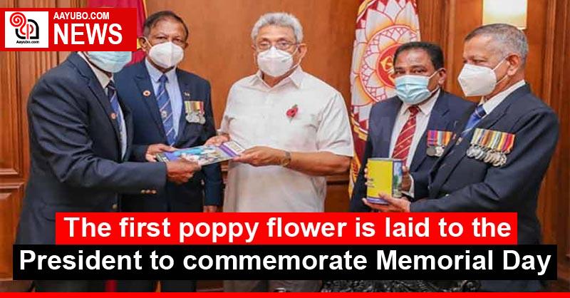 The first poppy flower is laid to the President to commemorate Memorial Day