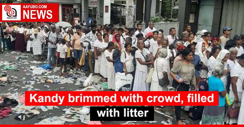 Kandy brimmed with crowd, filled with litter