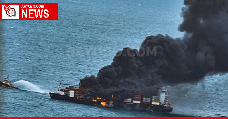 Explosion on board - containers fall  into the sea